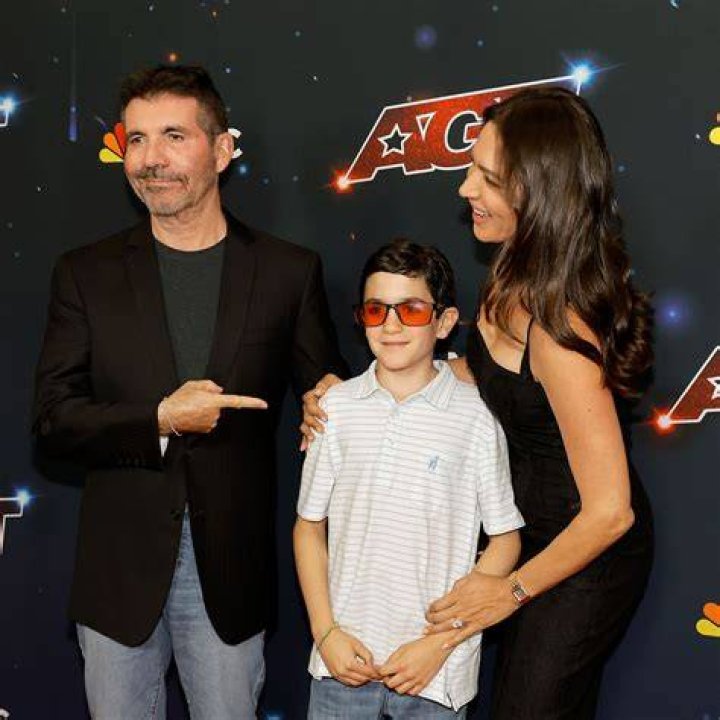 Simon Cowell and baby son Eric pul identical faces during flight