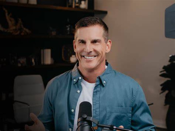 Smiling Craig Groeschel wearing a blue long sleeves and white shirt in